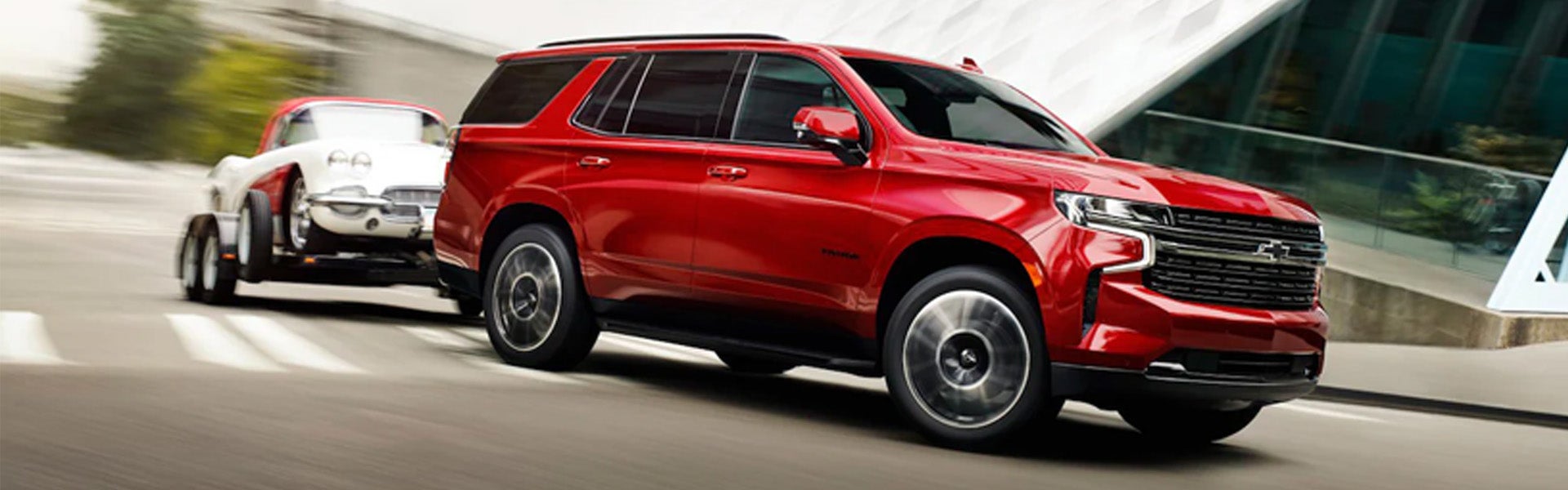 Chevy Tahoe side view drives along the road