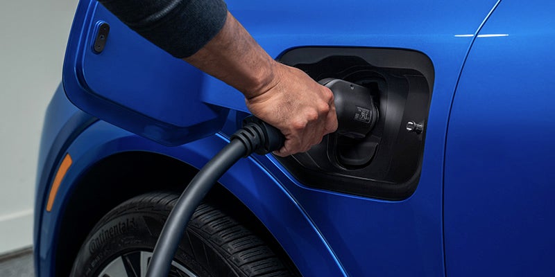 A Person plugging charge in car